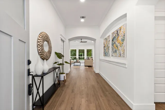 a en suite spacious bathroom with a double vanity sink a large mirror and shower