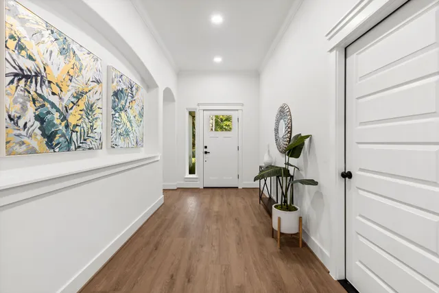 a bathroom with 2 sink a mirror and a shower
