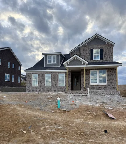 a front view of a house with yard