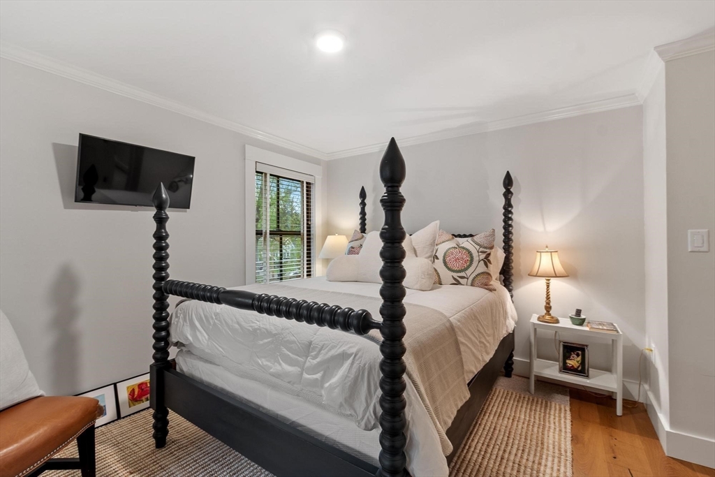 653 Main Street Concord, MA 01742 - Photo 32 of 42 a bedroom with bed tv and window