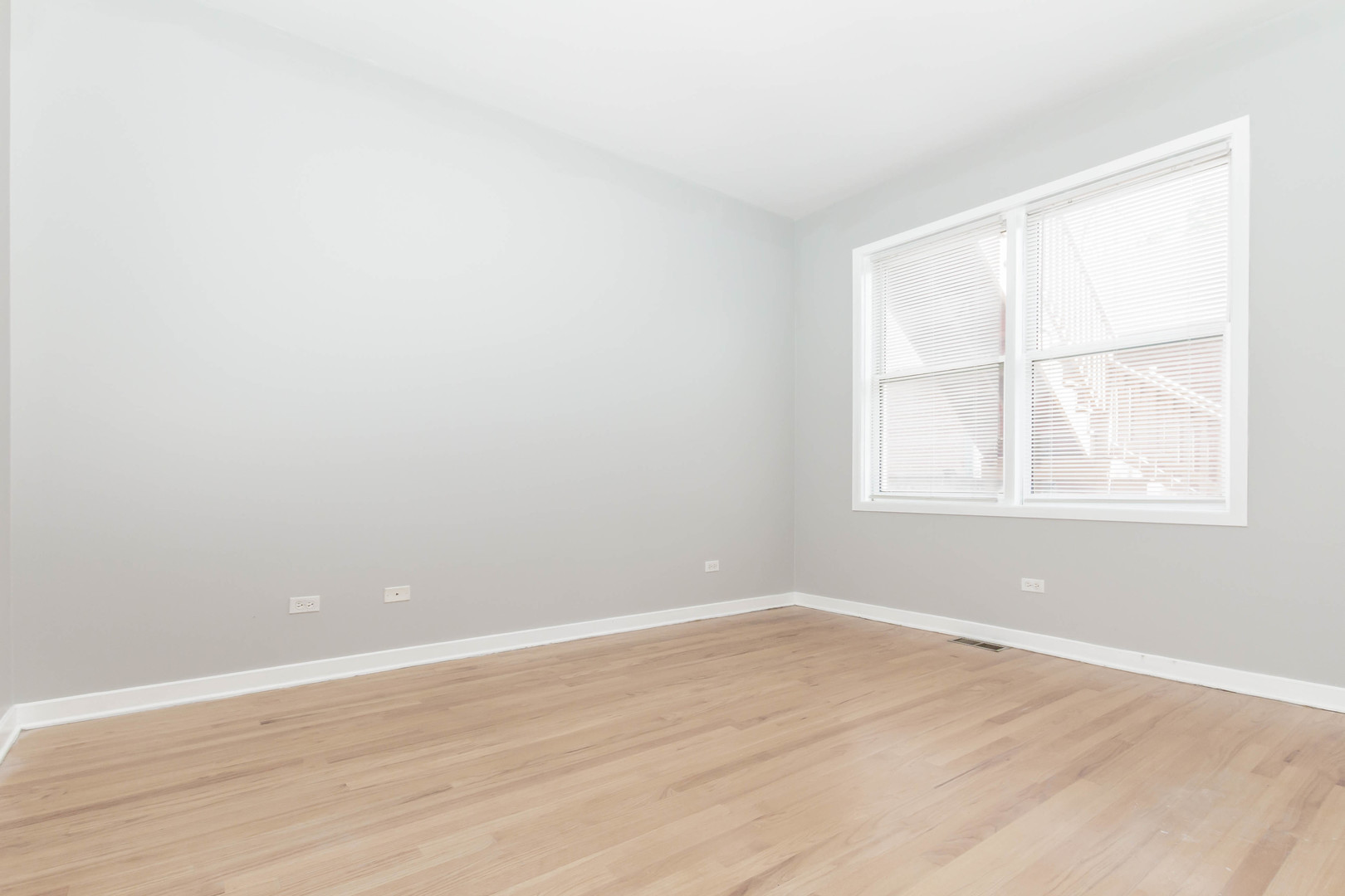 1443 West Fillmore Street Chicago, IL 60607 - Photo 12 of 37 an empty room with wooden floor and windows