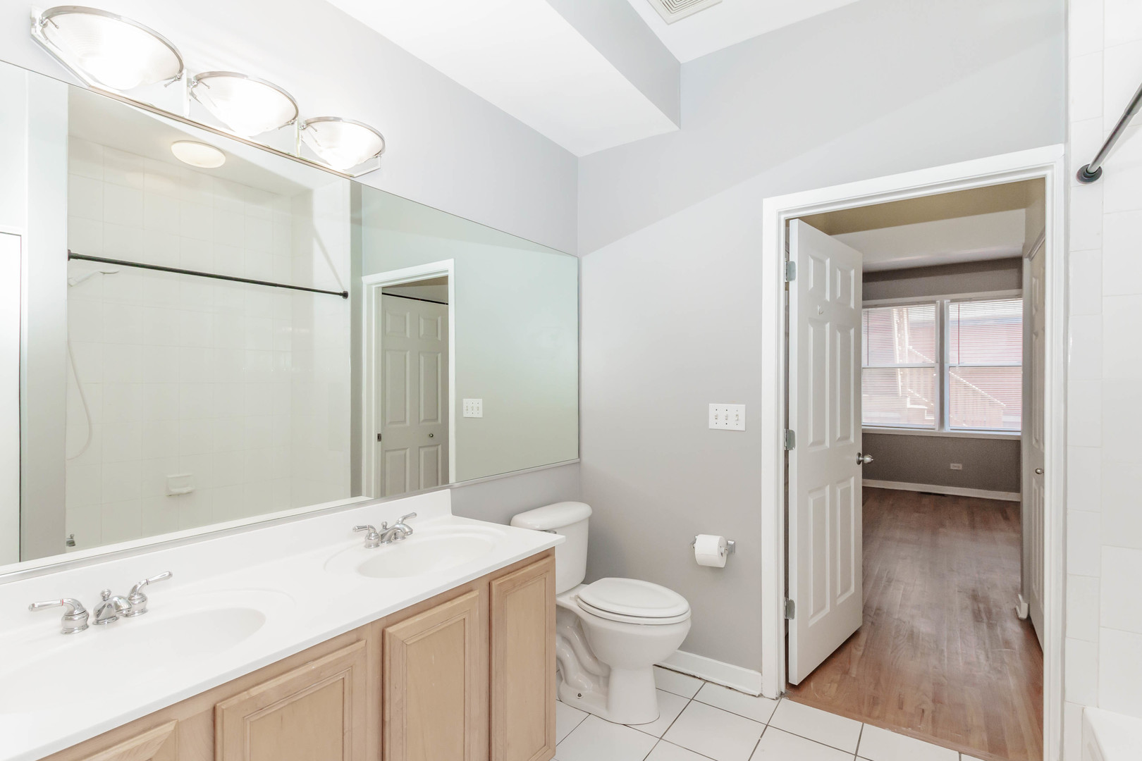 1443 West Fillmore Street Chicago, IL 60607 - Photo 13 of 37 a bathroom with a sink a toilet and shower