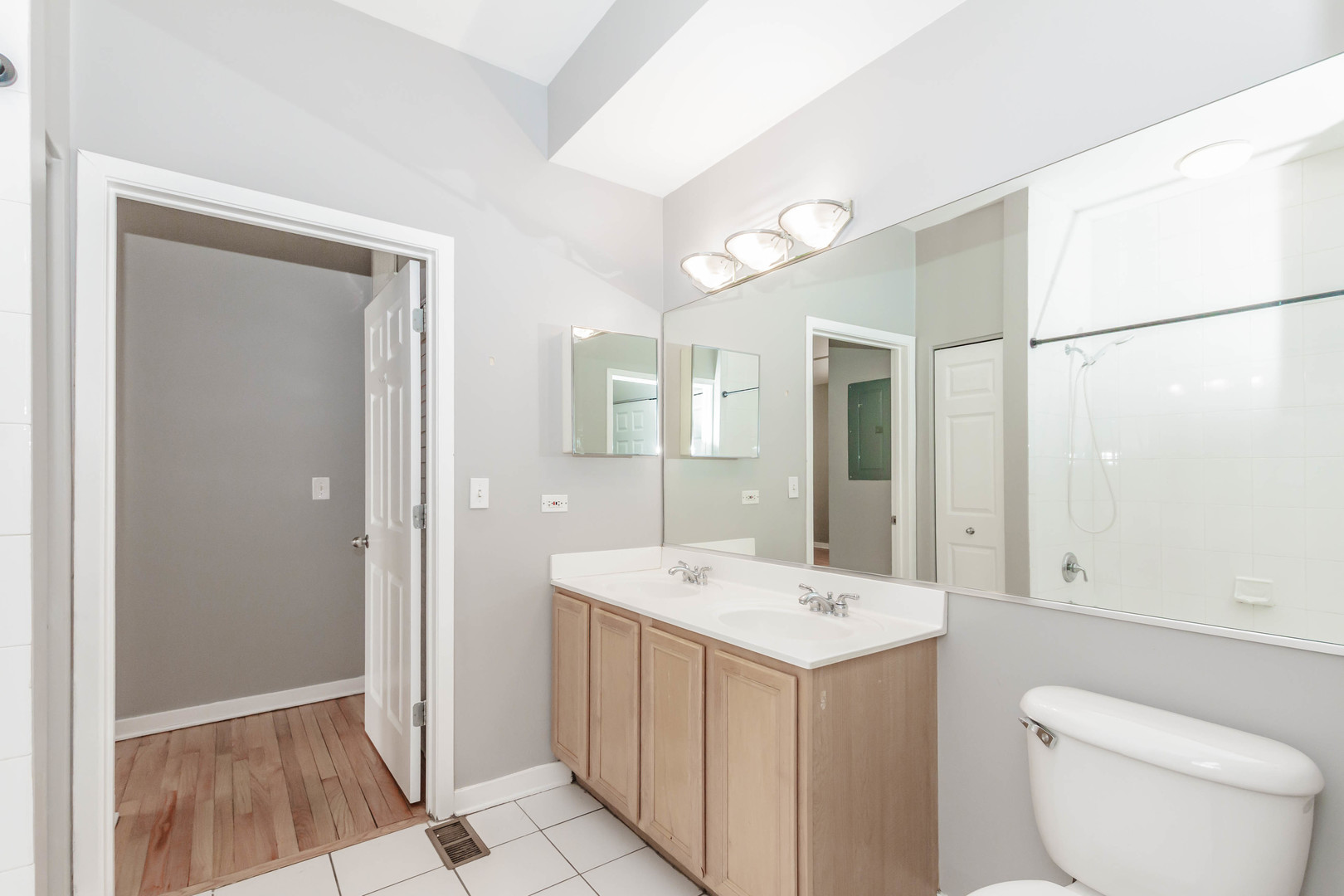 1443 West Fillmore Street Chicago, IL 60607 - Photo 14 of 37 a bathroom with a sink a toilet and shower