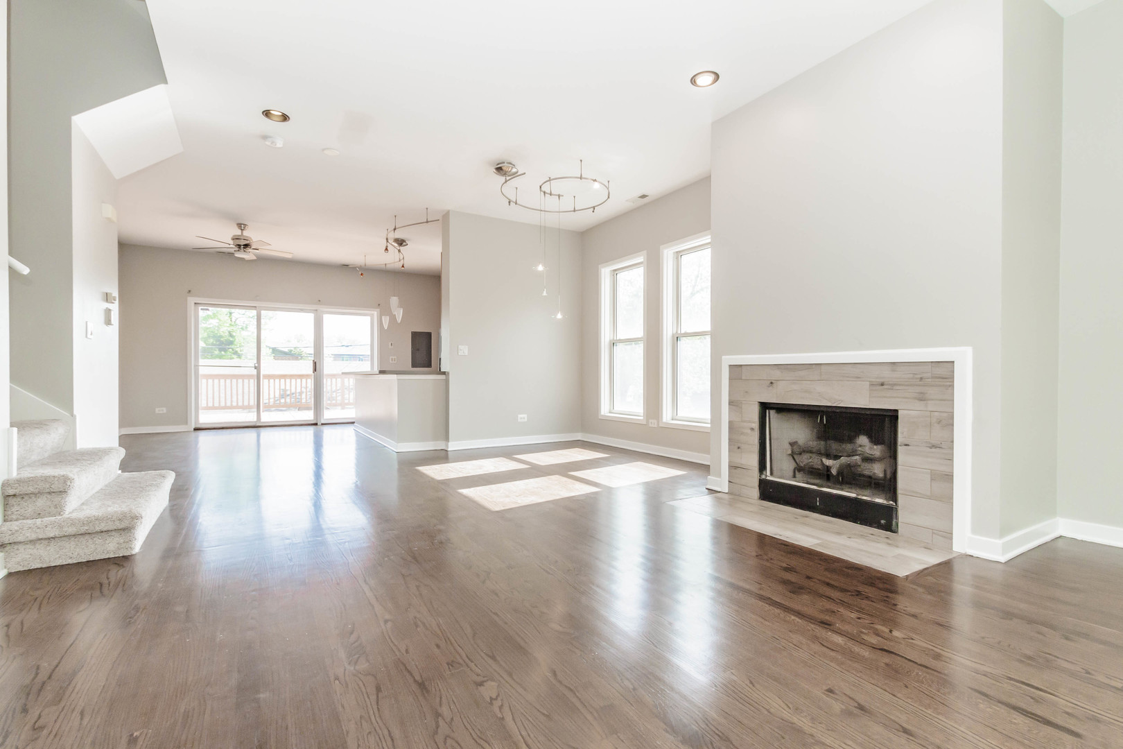 1443 West Fillmore Street Chicago, IL 60607 - Photo 16 of 37 an empty room with wooden floor and fireplace