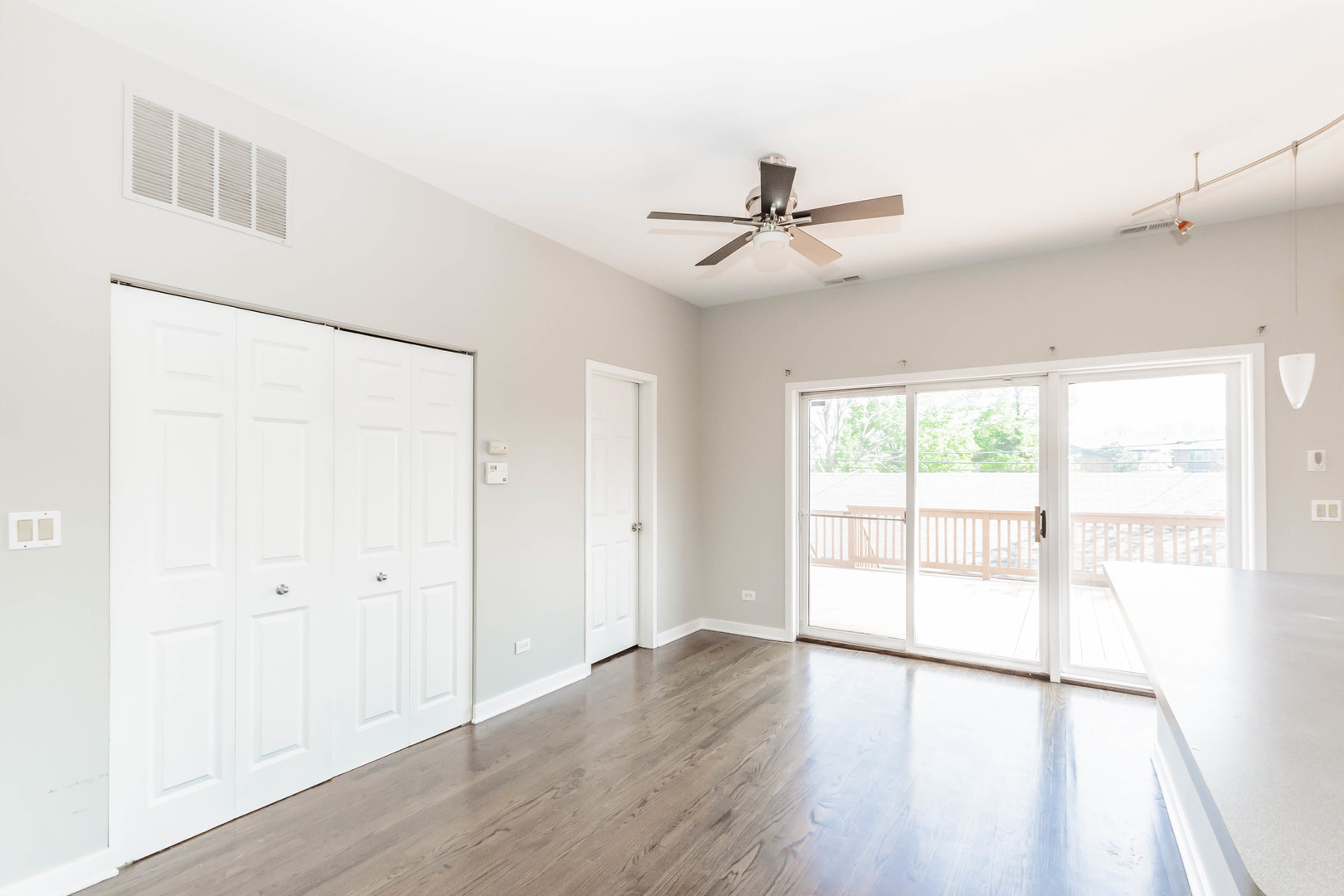 1443 West Fillmore Street Chicago, IL 60607 - Photo 18 of 37 a view of an empty room with wooden floor and a window