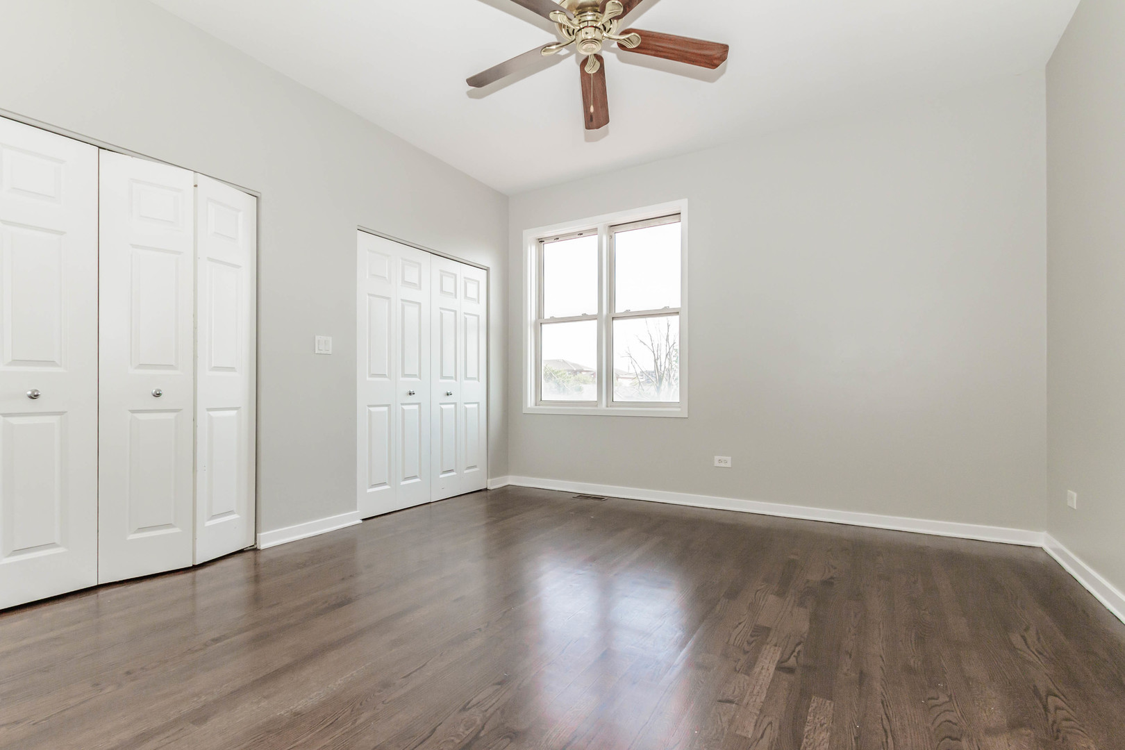 1443 West Fillmore Street Chicago, IL 60607 - Photo 22 of 37 a view of an empty room with wooden floor and a window