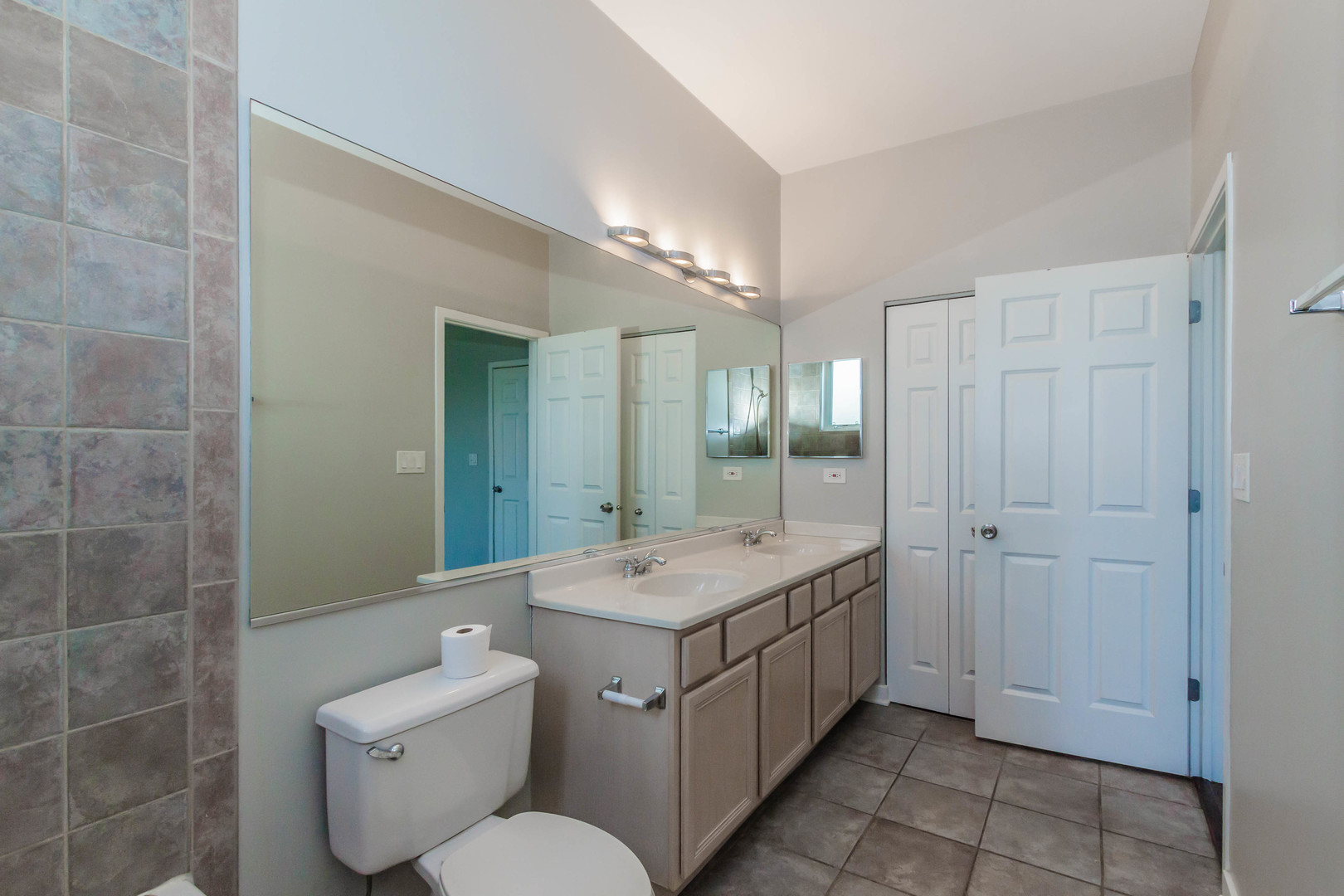 1443 West Fillmore Street Chicago, IL 60607 - Photo 24 of 37 a bathroom with a double vanity sink mirror and toilet