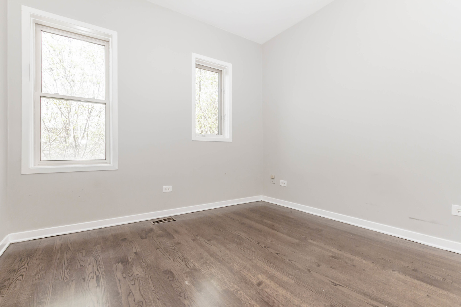 1443 West Fillmore Street Chicago, IL 60607 - Photo 26 of 37 an empty room with wooden floor and windows