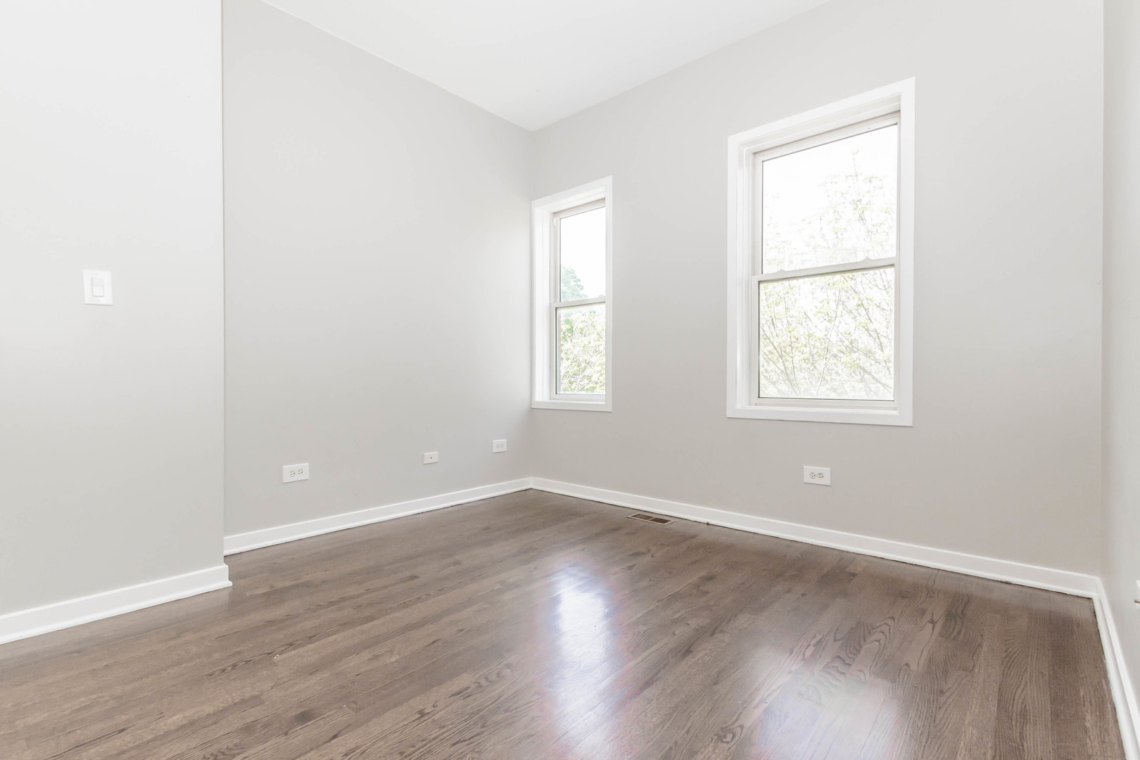 1443 West Fillmore Street Chicago, IL 60607 - Photo 27 of 37 an empty room with wooden floor and windows
