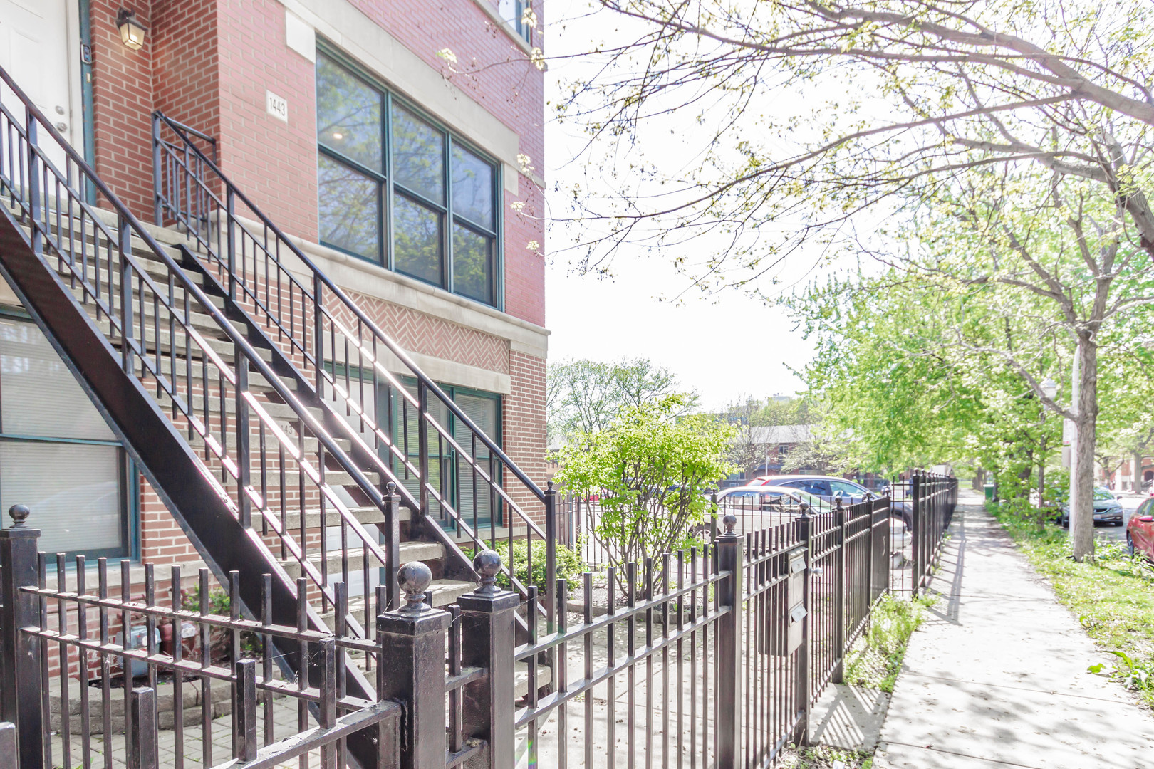 1443 West Fillmore Street Chicago, IL 60607 - Photo 3 of 37 a view of a building with wooden fence
