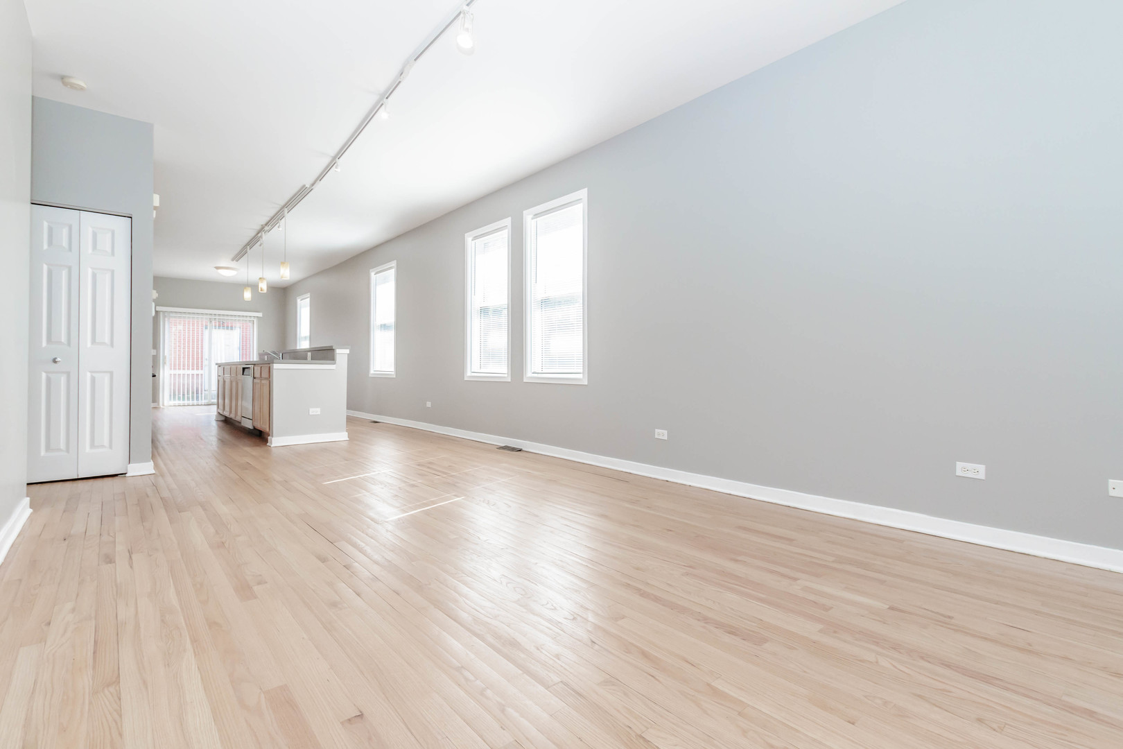 1443 West Fillmore Street Chicago, IL 60607 - Photo 4 of 37 a view of empty room with wooden floor and window
