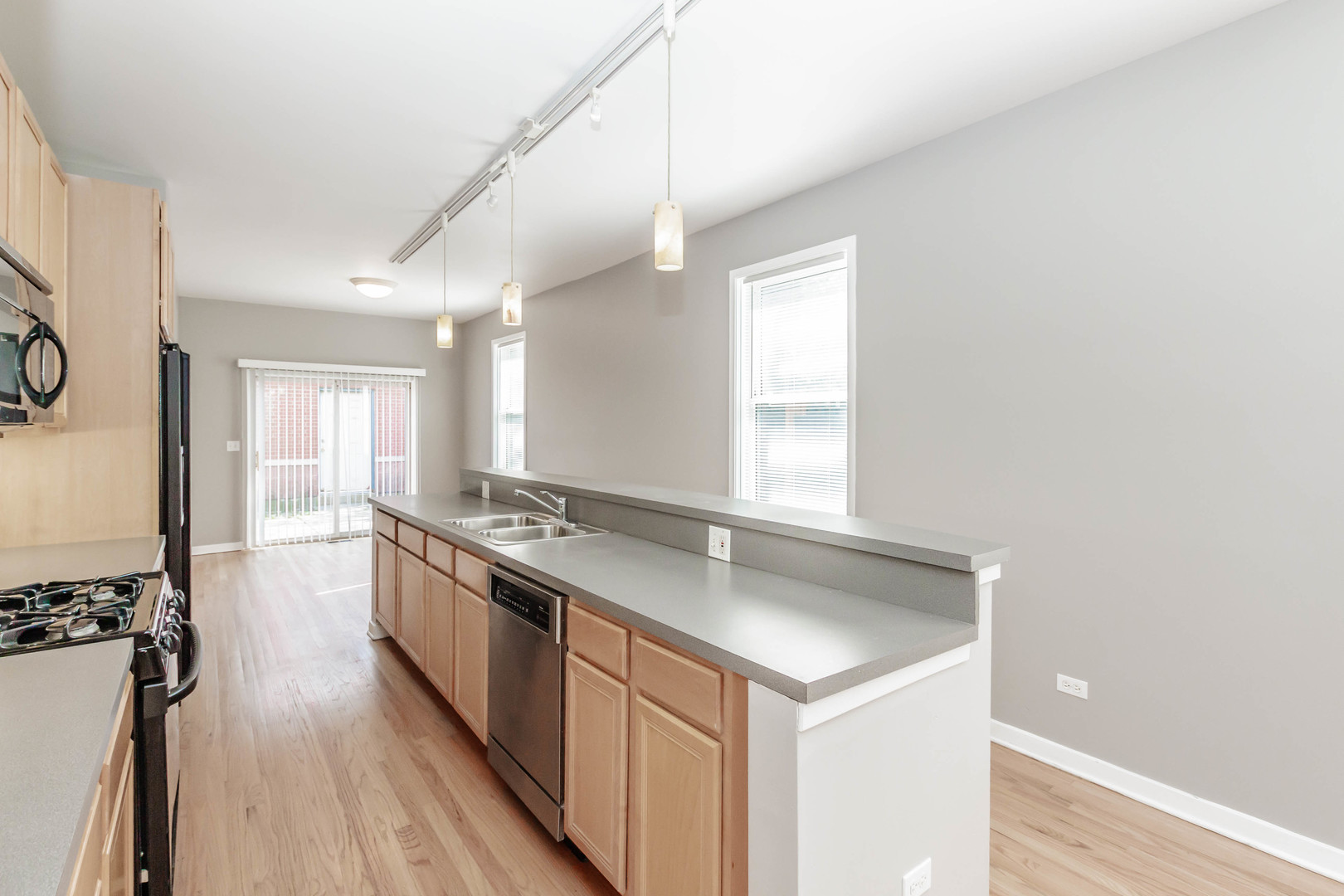 1443 West Fillmore Street Chicago, IL 60607 - Photo 7 of 37 a kitchen with a sink stove and wooden floor