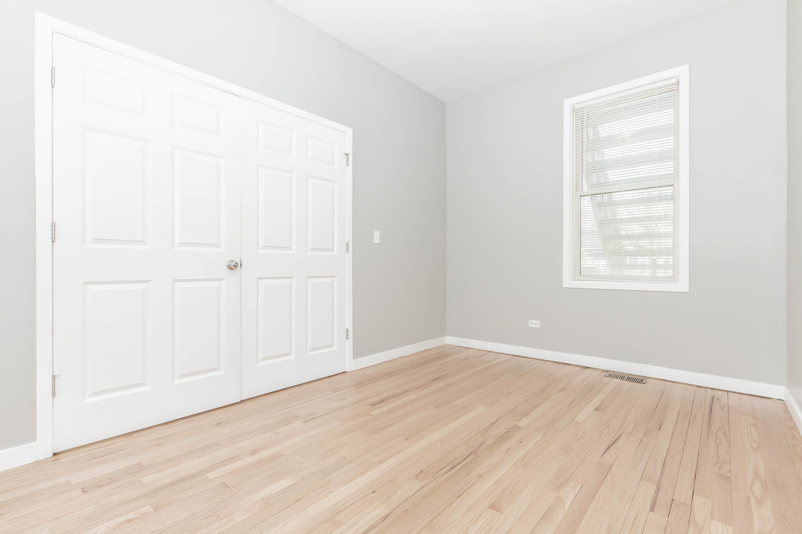 1443 West Fillmore Street Chicago, IL 60607 - Photo 10 of 37 an empty room with wooden floor and windows