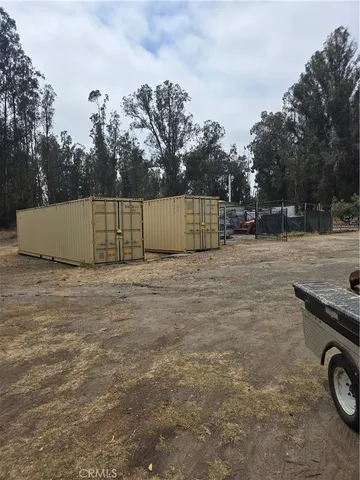 a view of street with wooden fence