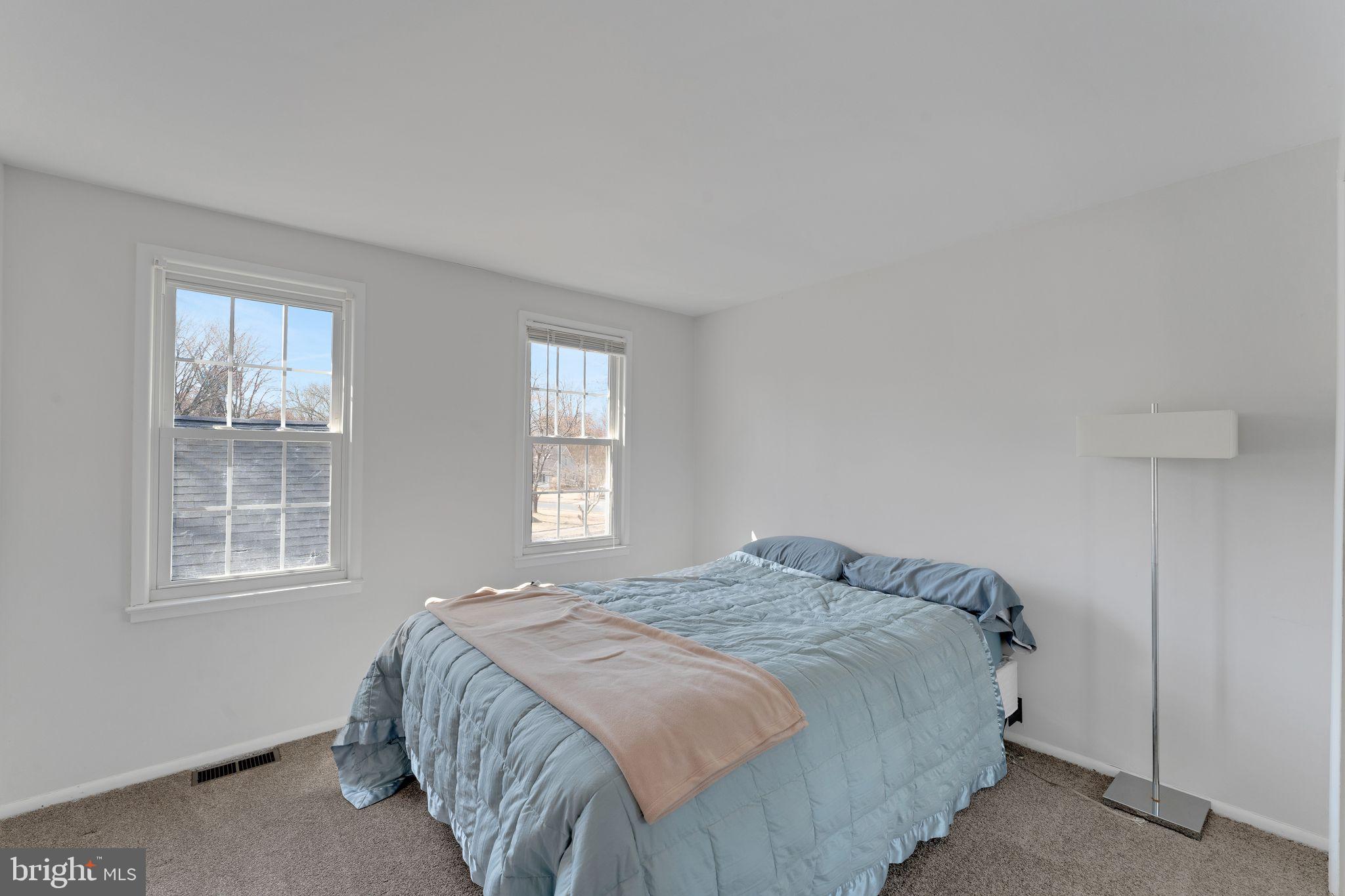1436 Jerrold Place Crofton, MD 21114 - Photo 16 of 34 a bedroom with a bed and a window