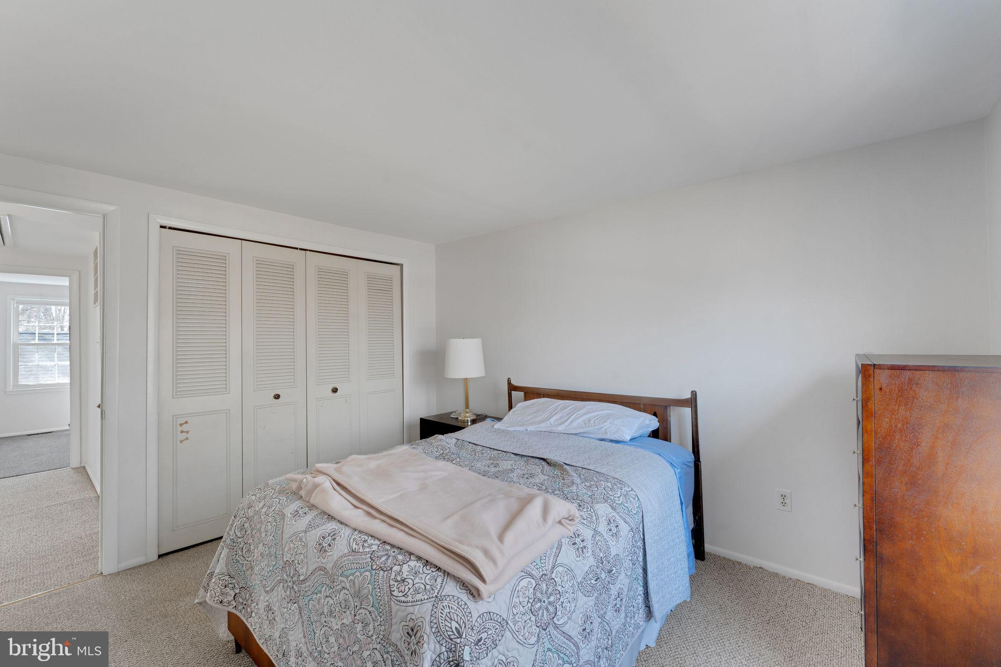 1436 Jerrold Place Crofton, MD 21114 - Photo 19 of 34 a bedroom with a bed and a window