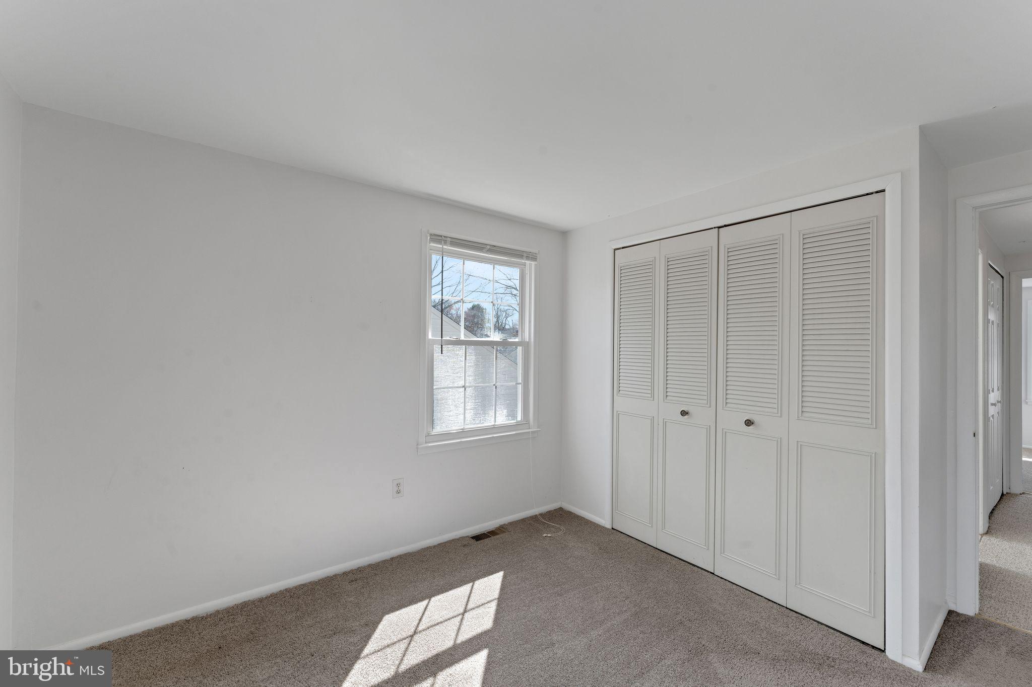 1436 Jerrold Place Crofton, MD 21114 - Photo 21 of 34 a view of an empty room with windows
