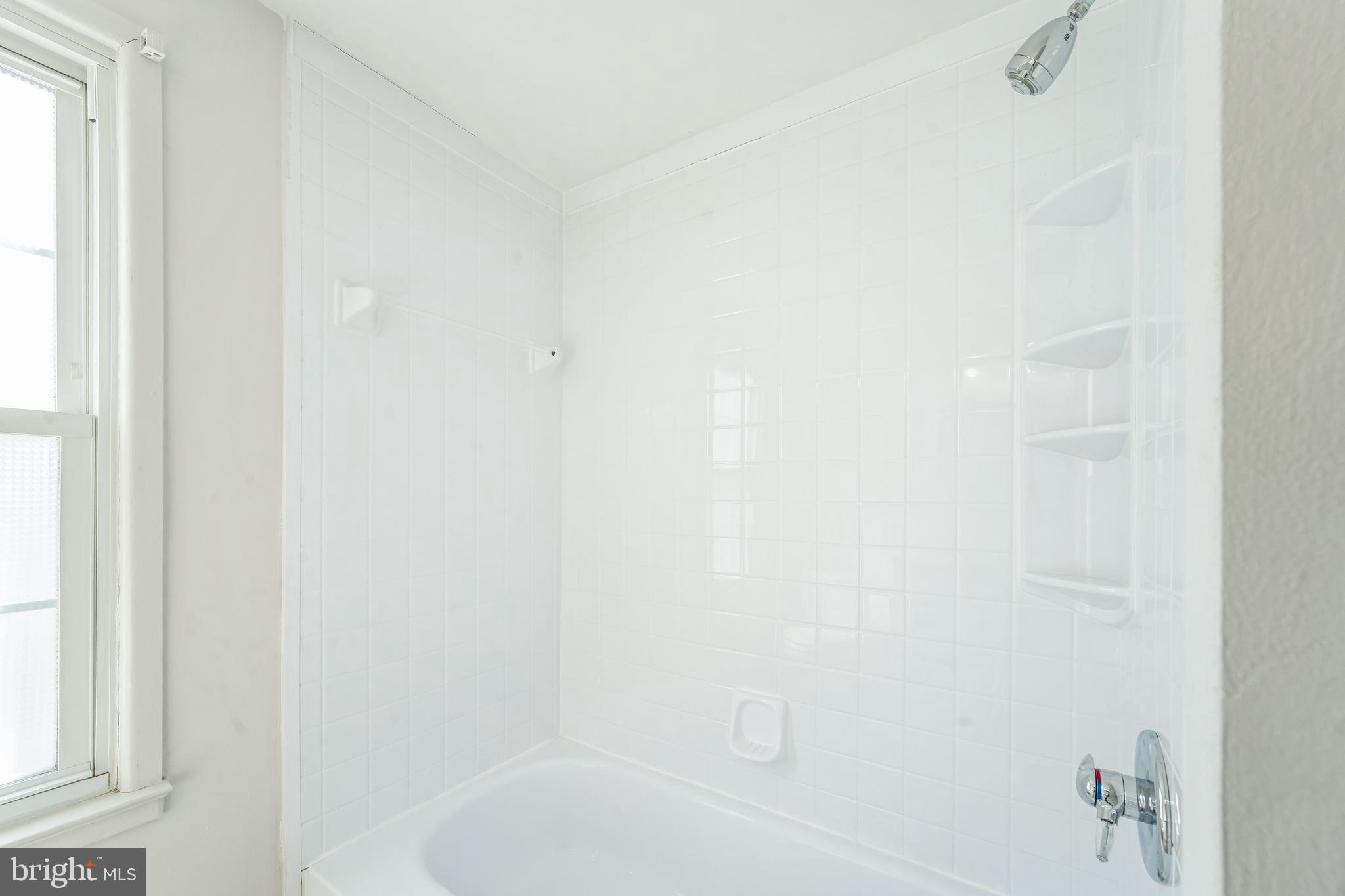 1436 Jerrold Place Crofton, MD 21114 - Photo 24 of 34 a bathroom with a bathtub