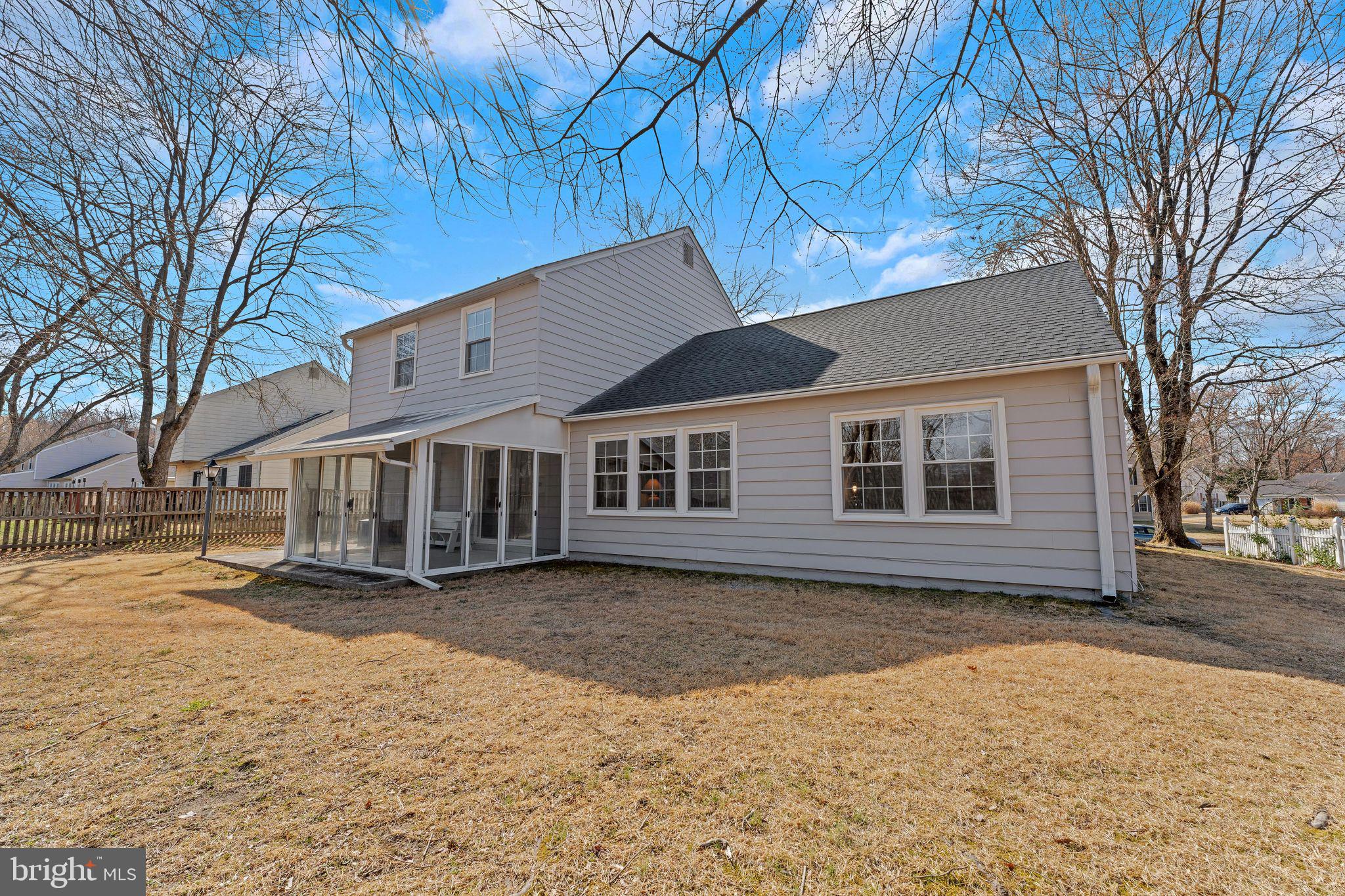 1436 Jerrold Place Crofton, MD 21114 - Photo 27 of 34 a front view of a house with a yard covered in snow