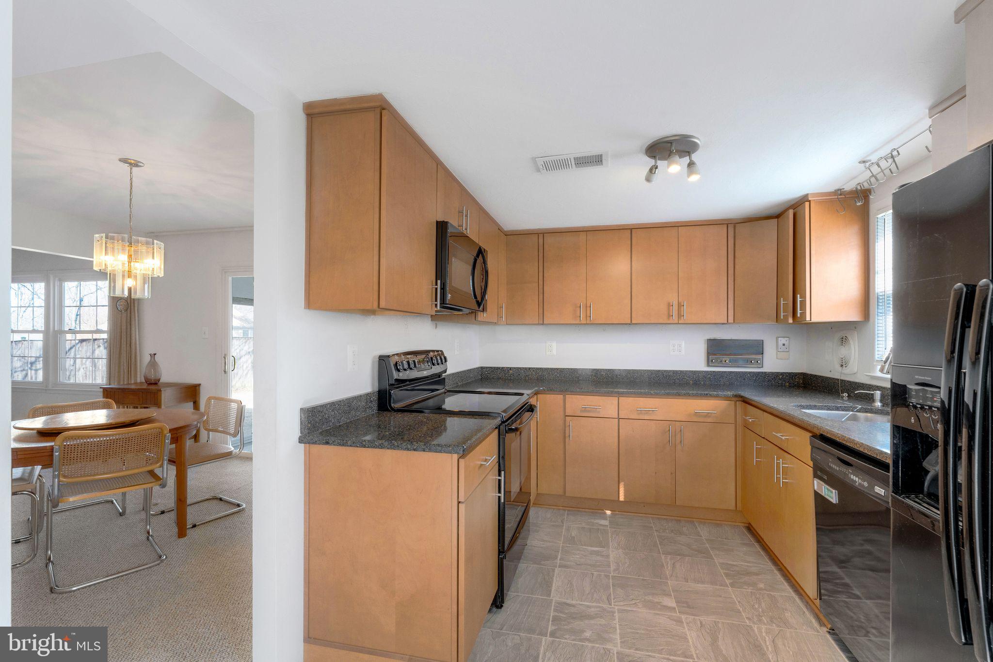 1436 Jerrold Place Crofton, MD 21114 - Photo 10 of 34 a kitchen with stainless steel appliances granite countertop sink stove top oven and cabinets