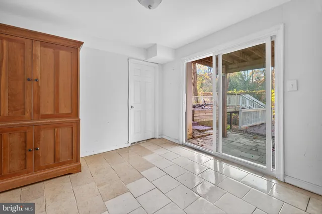 a view of an entryway with wooden floor