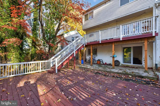 a view of a house with a wooden deck