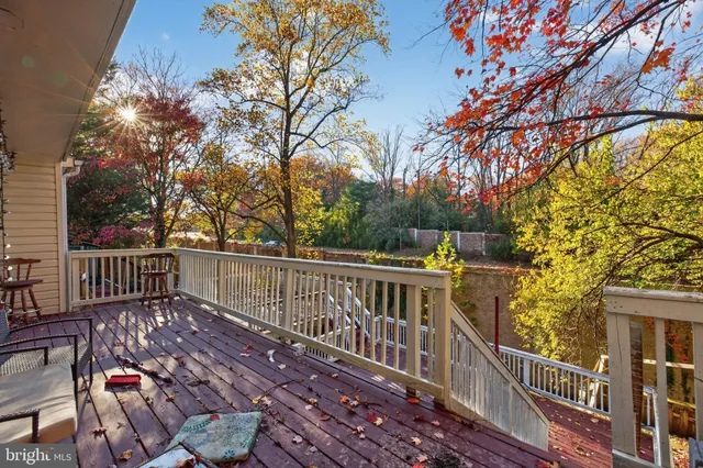 a view of a wooden deck with a bench