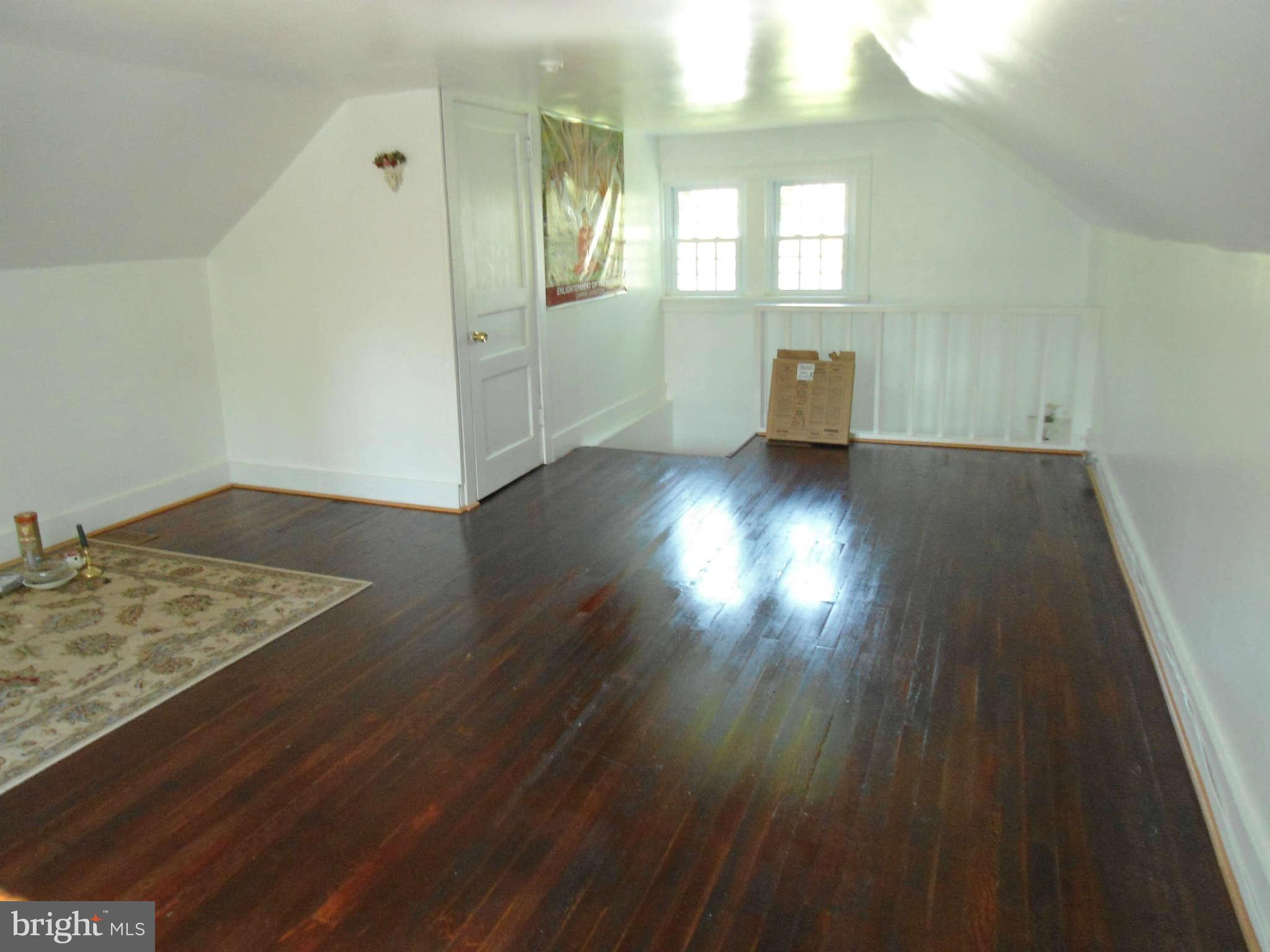 2419 Briggs Chaney Road Silver Spring, MD 20905 - Photo 22 of 26 a view of empty room with wooden floor