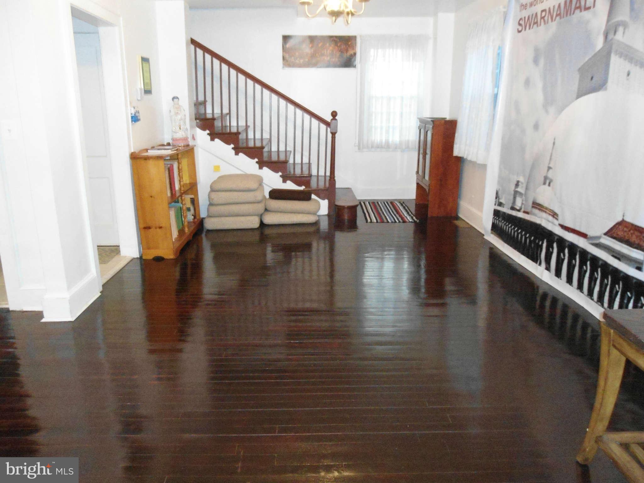 2419 Briggs Chaney Road Silver Spring, MD 20905 - Photo 8 of 26 a view of entryway and hall with wooden floor