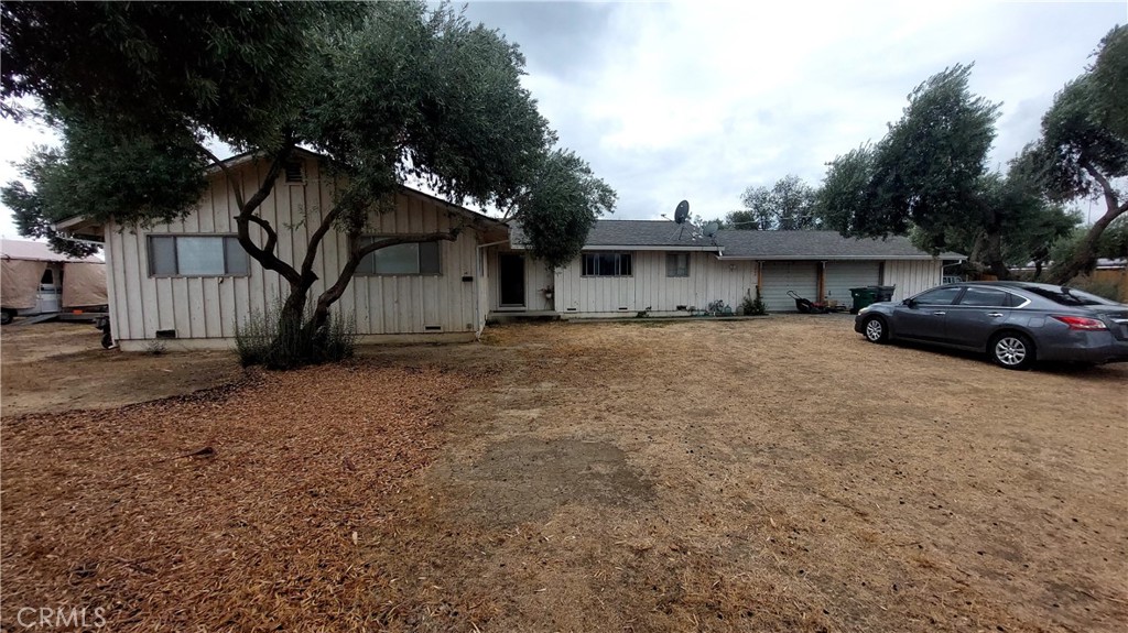 a view of a car parked in front of a house