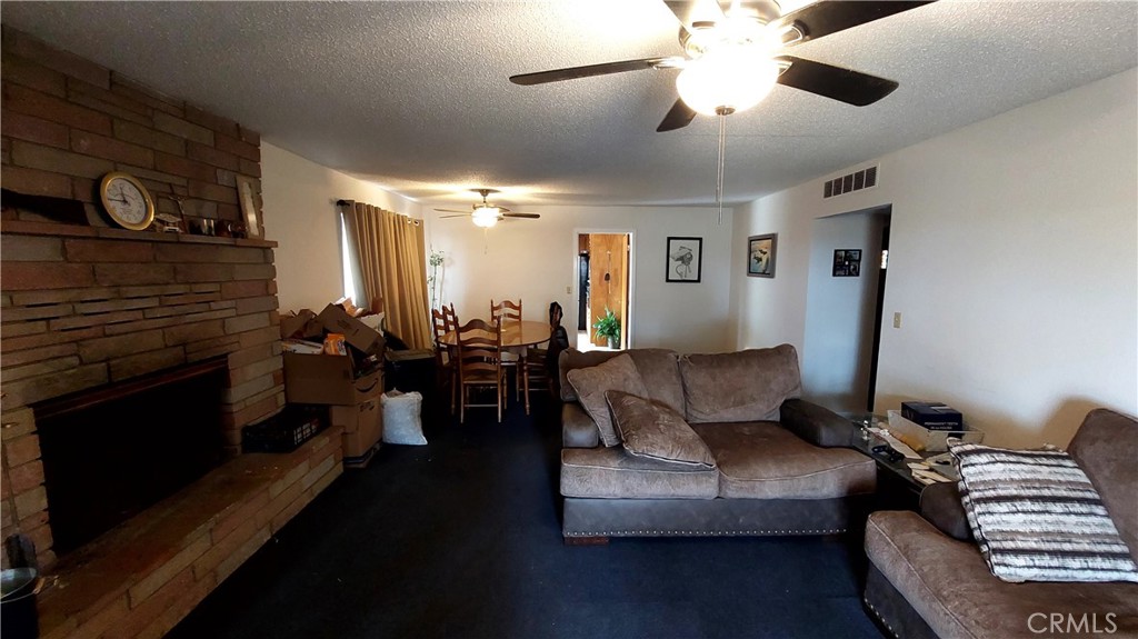 1547 Blackburn Avenue Corning, CA 96021 - Photo 25 of 51 a living room with furniture and wooden floor