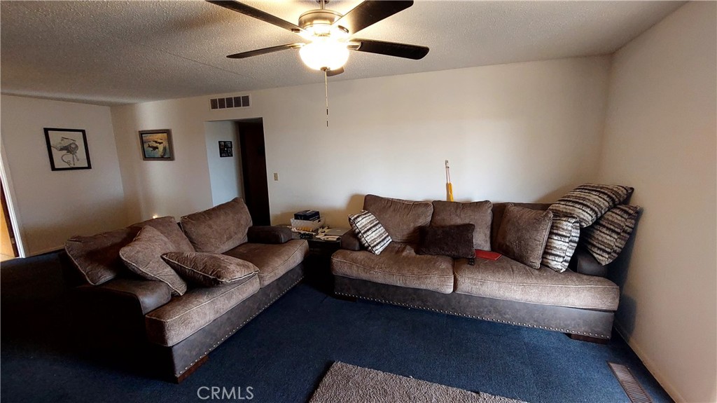 1547 Blackburn Avenue Corning, CA 96021 - Photo 26 of 51 a living room with furniture and a lamp
