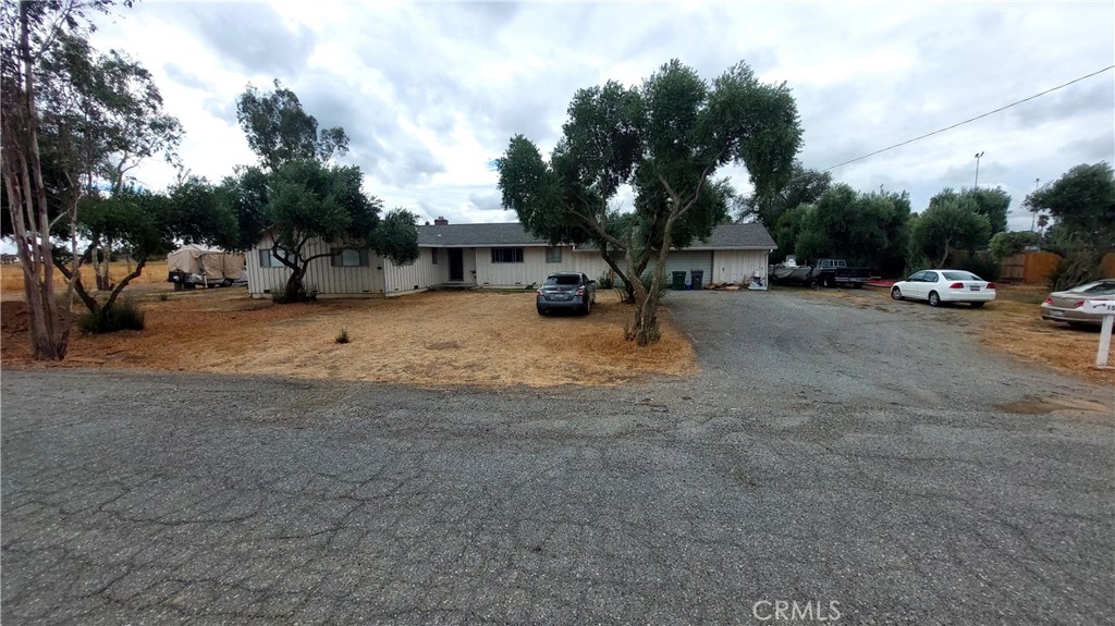 1547 Blackburn Avenue Corning, CA 96021 - Photo 3 of 51 a view of a dirt road with a building in the background