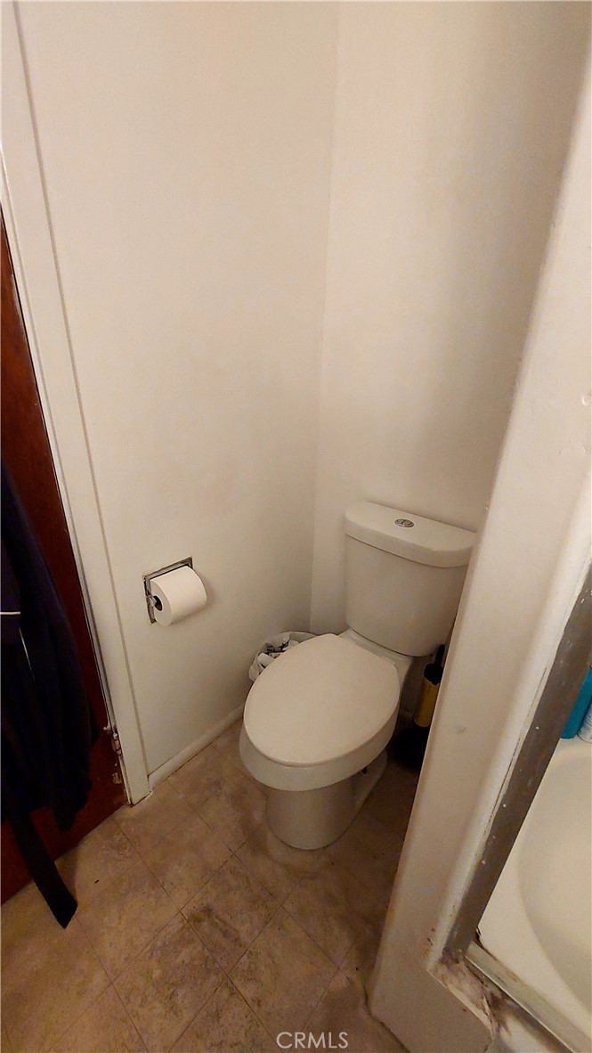 1547 Blackburn Avenue Corning, CA 96021 - Photo 35 of 51 a white toilet sitting next to a shower