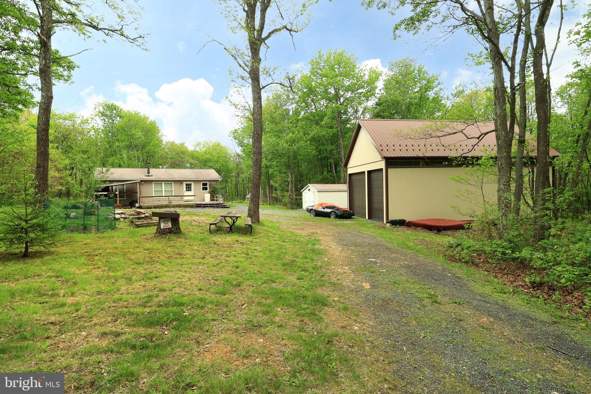 a house view with a backyard space