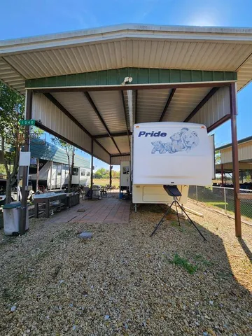 a view of a backyard space with a patio