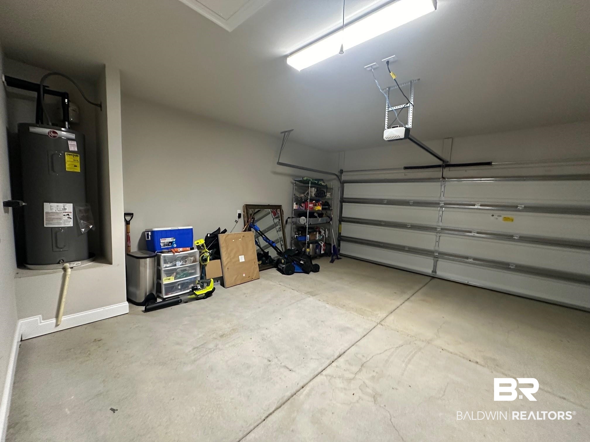 1009 Ruisseau Drive Foley, AL 36535 - Photo 54 of 55 Garage featuring water heater and a garage door opener