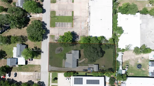 an aerial view of multiple houses with yard