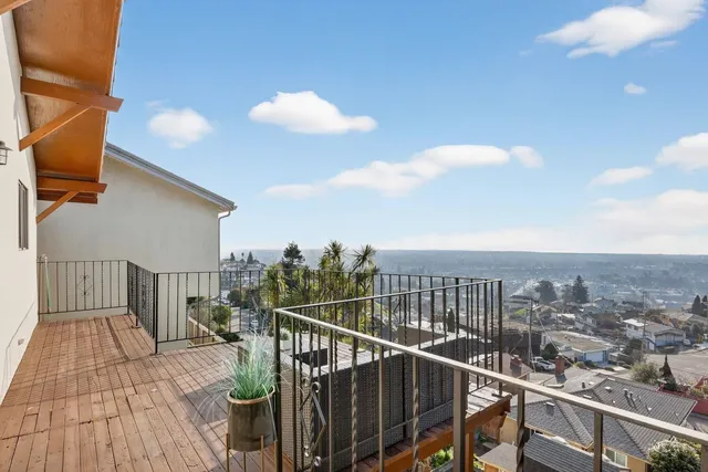 a view of a balcony with wooden floor