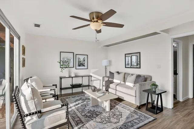 a living room with furniture and a window