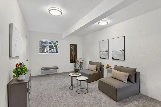 a living room with furniture and a table