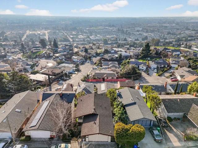 an aerial view of a city with lots of residential buildings