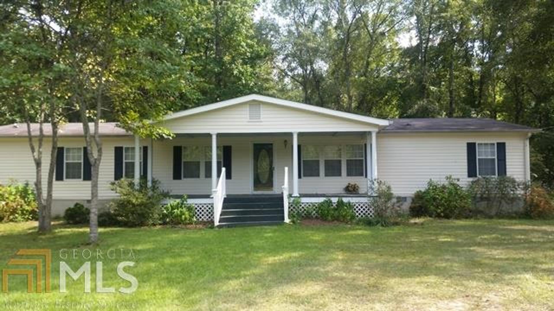 906 Hicks Road Roberta, GA 31078 - Photo 1 of 1 a front view of house with yard and green space