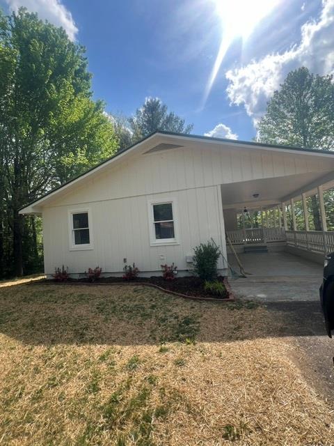 1616 Abe Cove Road Hiawassee, GA 30546 - Photo 2 of 17 a view of a house with a yard