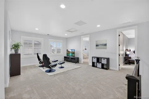 a bedroom with a bed and dresser