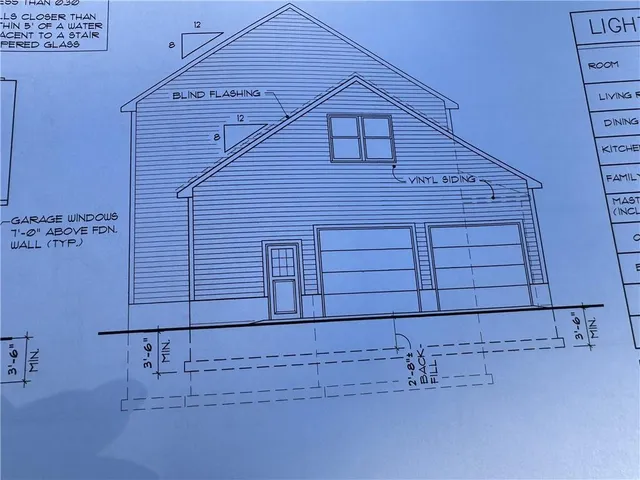 an empty room with wooden floor fireplace and windows