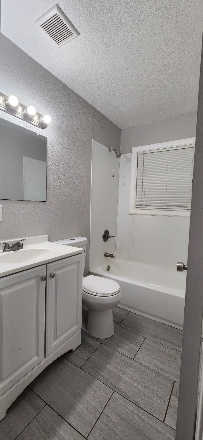 128 Huisache Street Lake Jackson, TX 77566 - Photo 12 of 23 a bathroom with a sink a toilet and shower