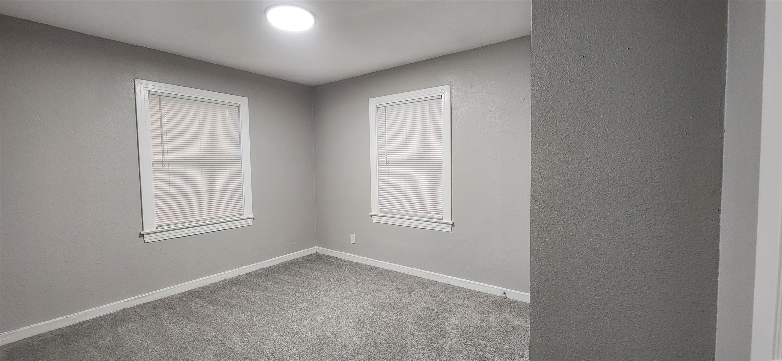 128 Huisache Street Lake Jackson, TX 77566 - Photo 14 of 23 an empty room with windows and closet