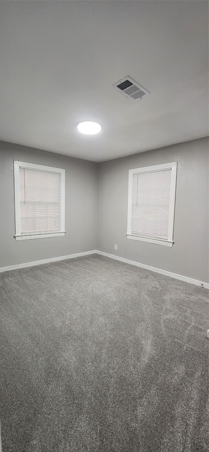 128 Huisache Street Lake Jackson, TX 77566 - Photo 15 of 23 an empty room with windows
