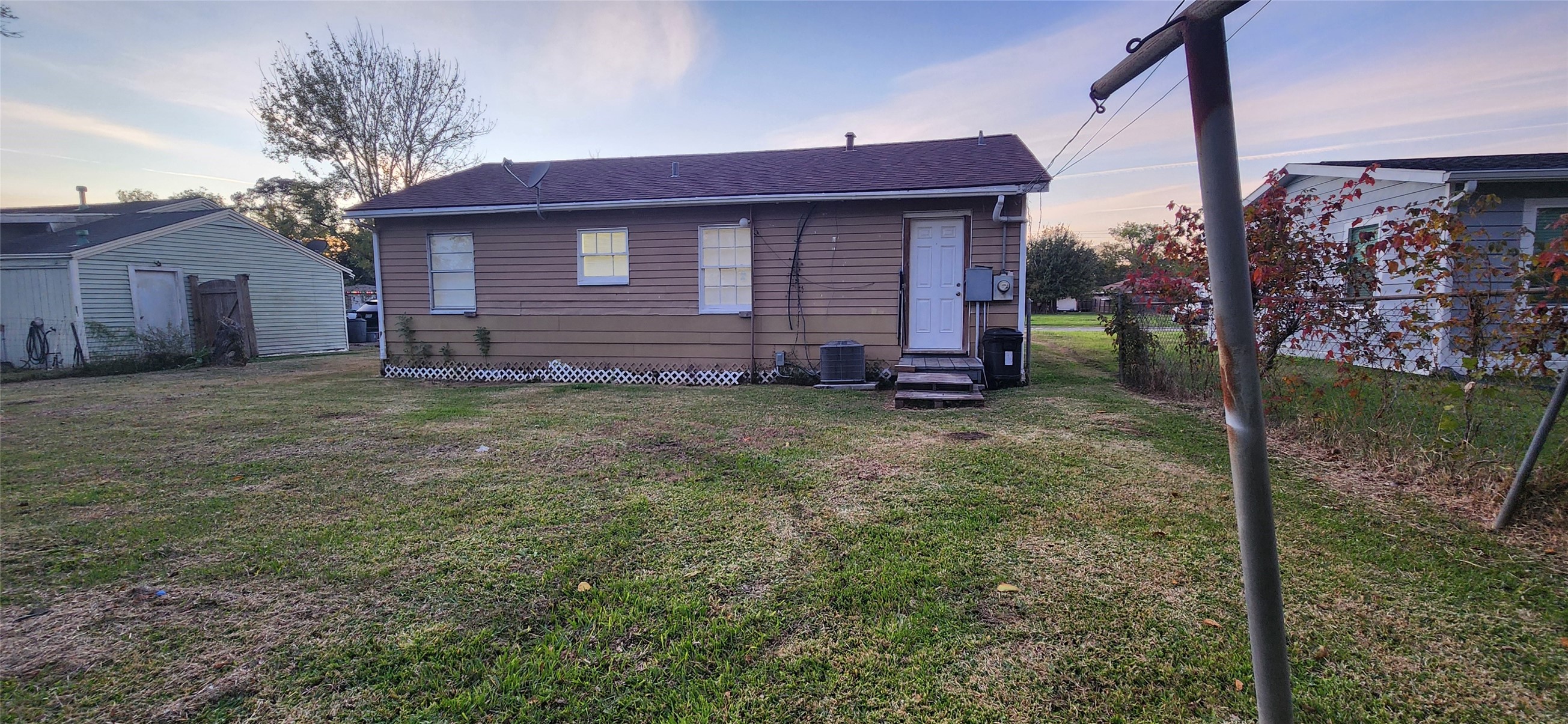 128 Huisache Street Lake Jackson, TX 77566 - Photo 21 of 23 a red brick house with yard in front of it
